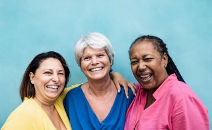 Image: Adobe Three women of different ethnicities posing and smiling